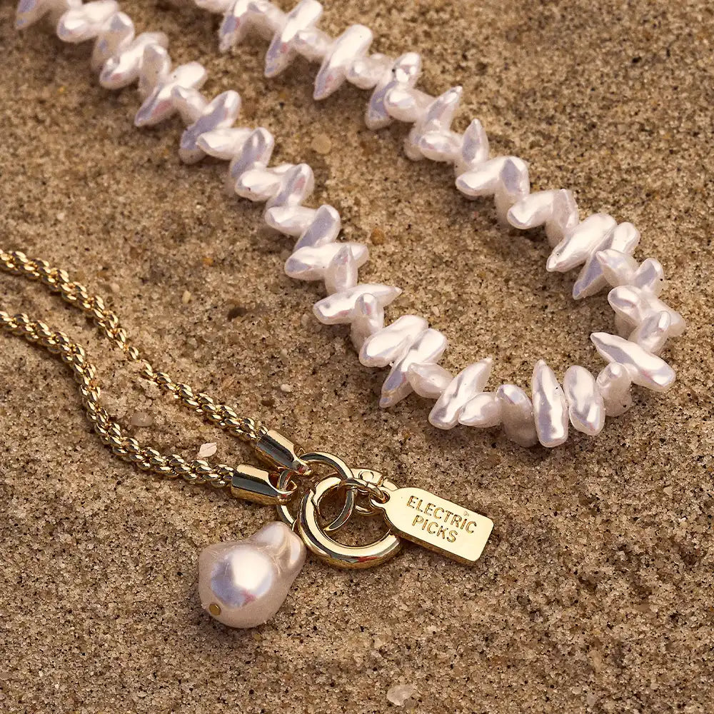 Coral Pearl Clam Charm — Phone Wristlet