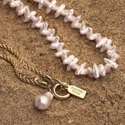 Coral Pearl Clam Charm — Phone Wristlet